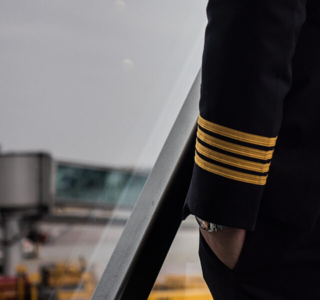Pilot,In,4,Strips,Jacket,Uniform,In,Passenger,Jet,Bridge